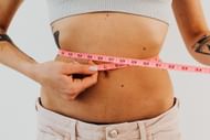 Reverse crunches tone the six pack ab muscles. (Photo via Pexels/Karolina Grabowska)